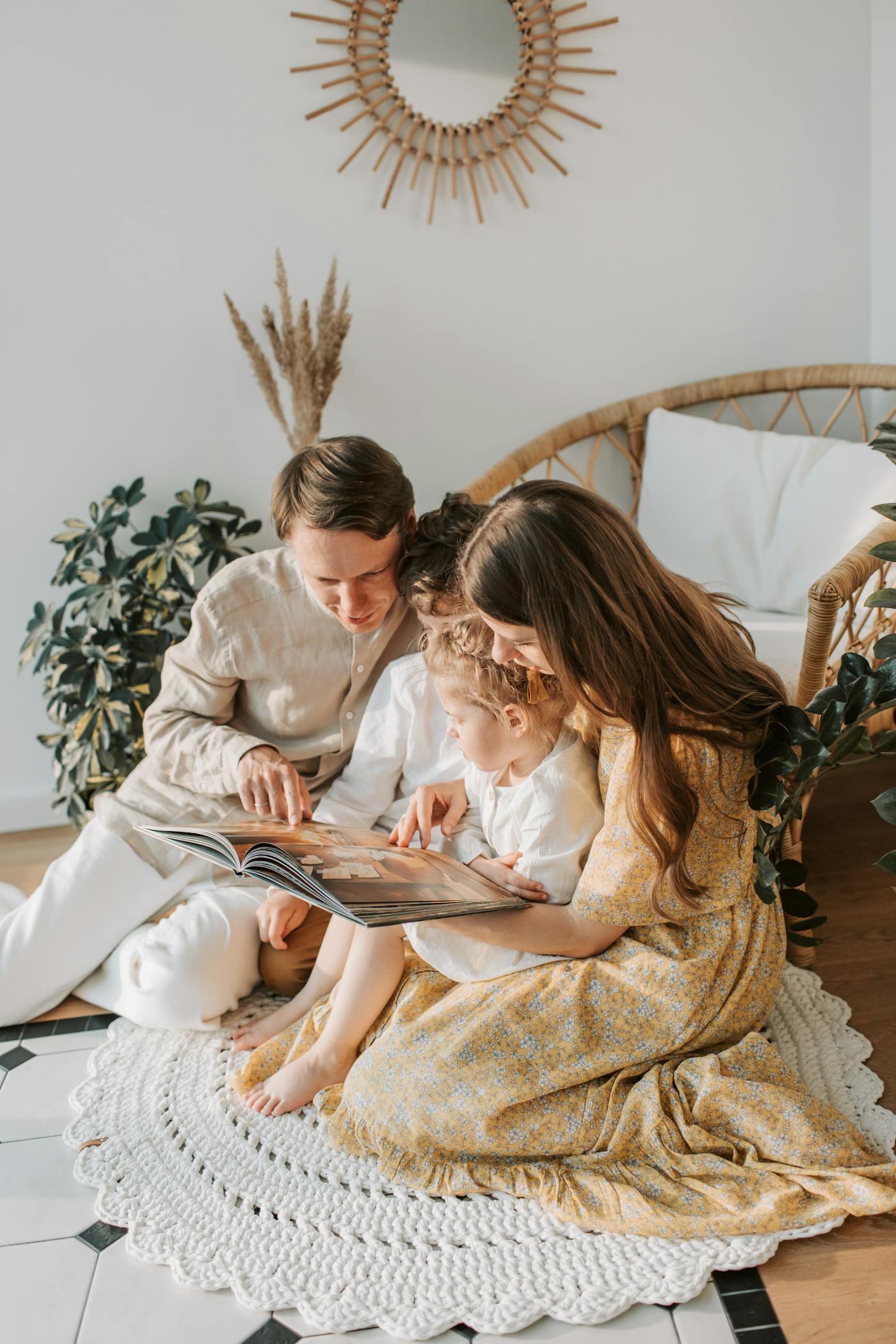 Family spending time reading together at home