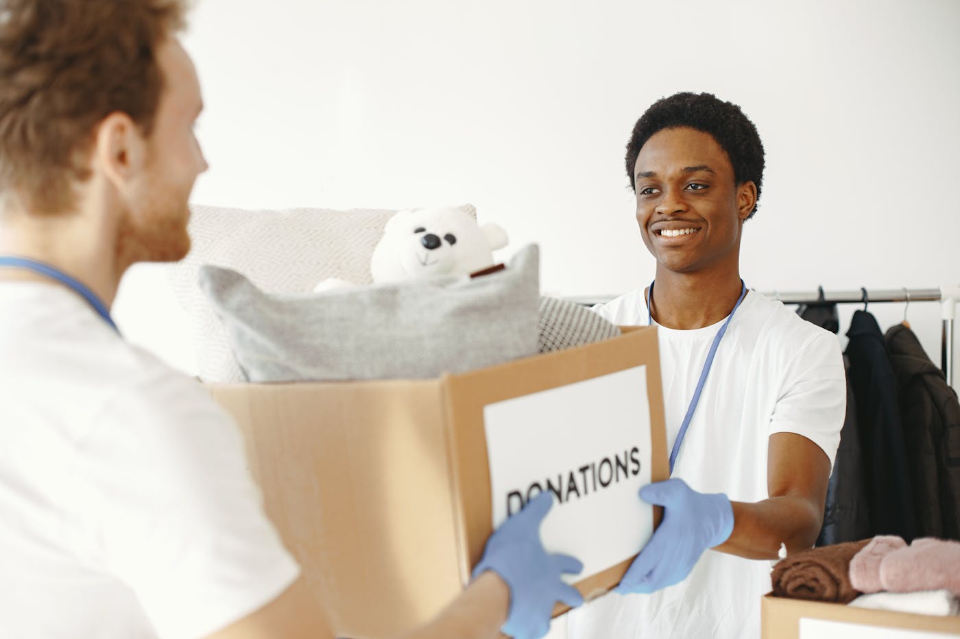Volunteers handing over donation boxes
