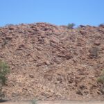 A rocky hillside beside the Todd River in Alice Springs